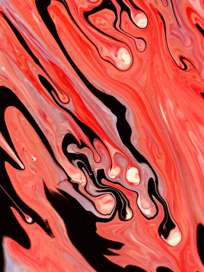 Dynamic abstract painting featuring vivid red and black swirls creating a sense of motion and fluidity.